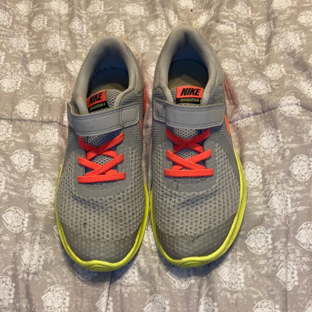 Pink and yellow Nike.